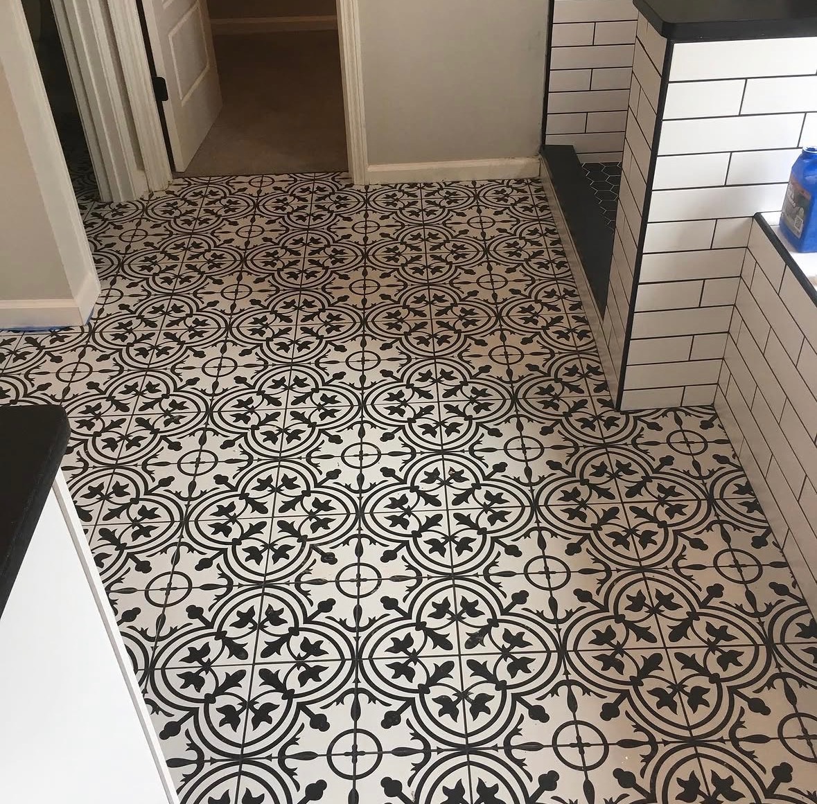Black and white patterned floor tile