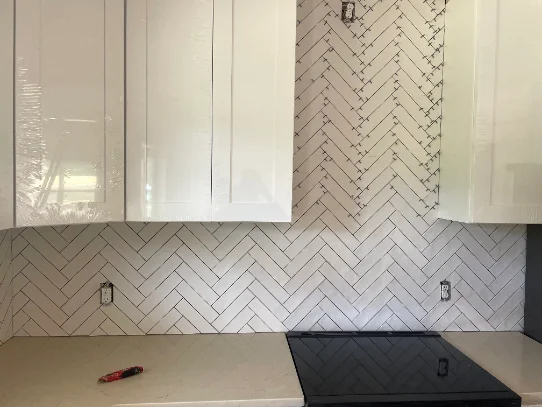 Herringbone tile kitchen backsplash